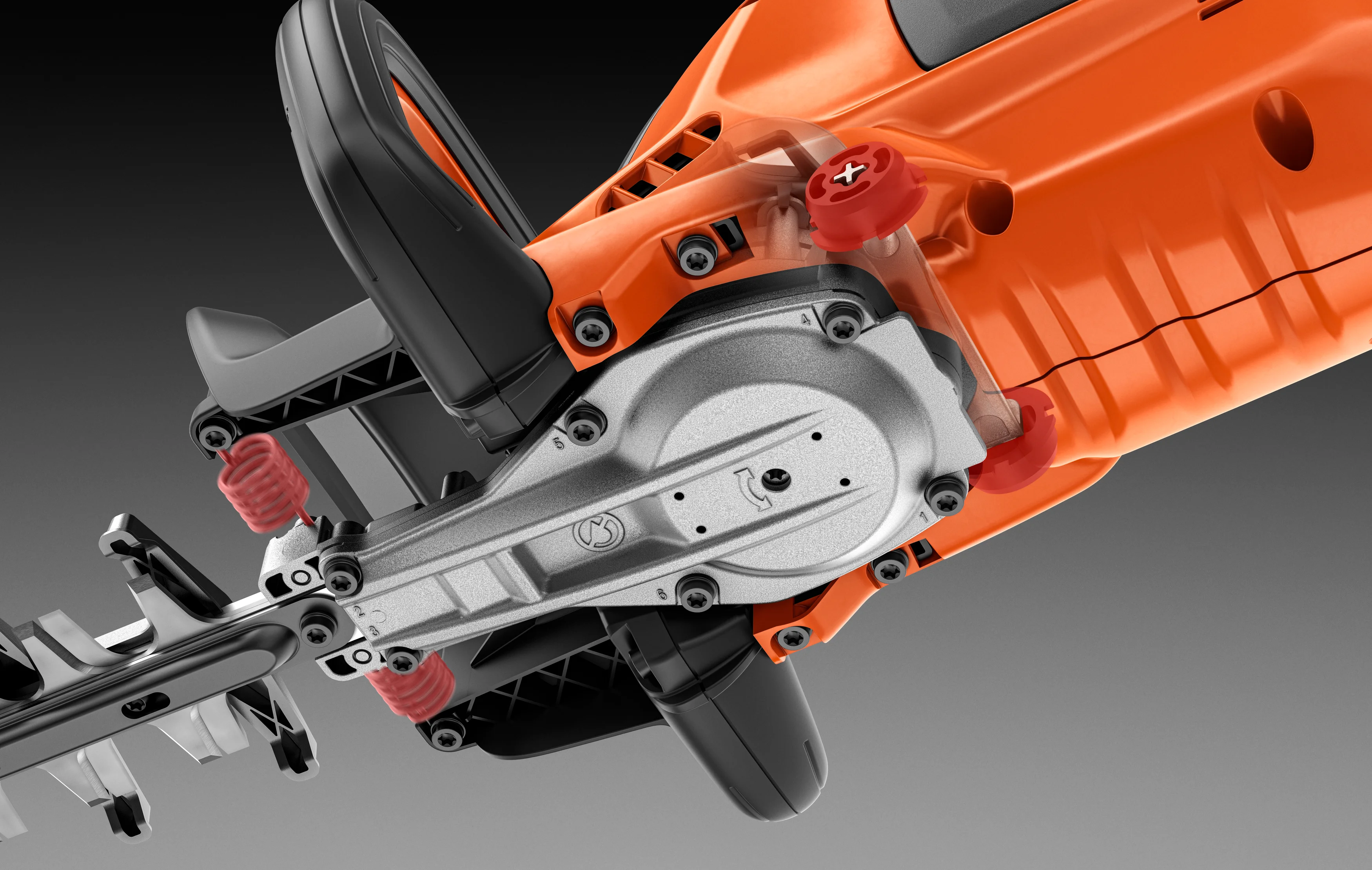 Detailansicht eines orangefarbenen Husqvarna Gartengeräts mit sichtbarem Antrieb, Schneidwerkzeug und technischen Komponenten